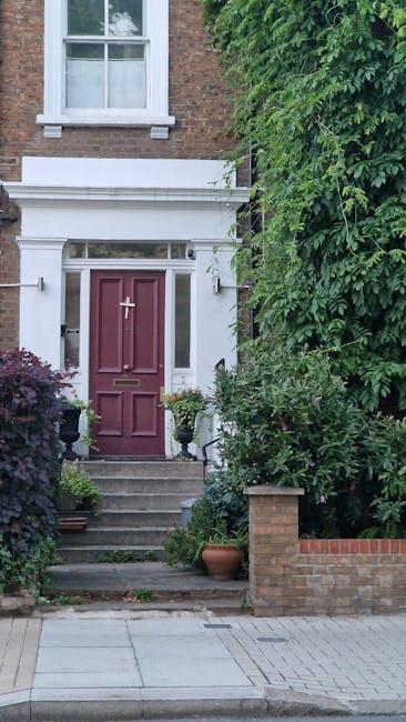 The image depicts the front entrance of a residential property with a blue painted door featuring decorative paneling and a metal lion head door knocker. To the left of the door, a sign reads 'CHAPEL 